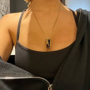 Coach gold dinosaur pendant with chain